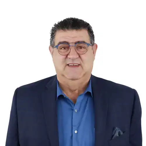 Headshot of George Nassar wearing glasses and a blue suit jacket with a blue shirt.
