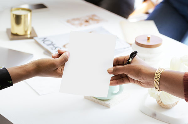 The Importance of Paper Texture. Women handing a paper in the meeting room.