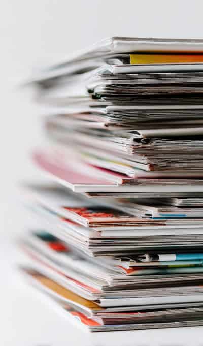 Stack of printed and bound materials produced on FSC certified paper
