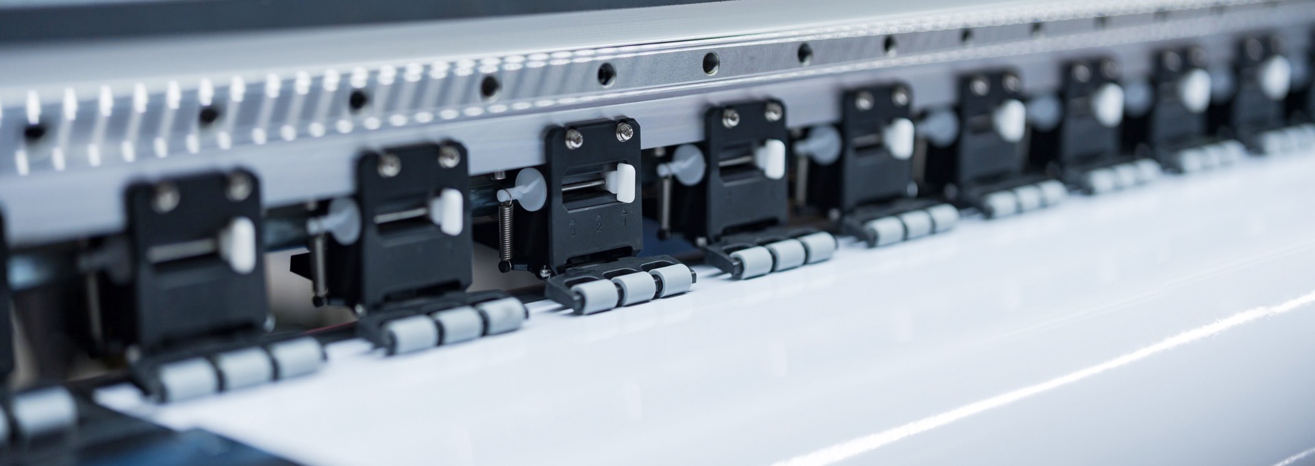 Media feed rollers on a wide format printer