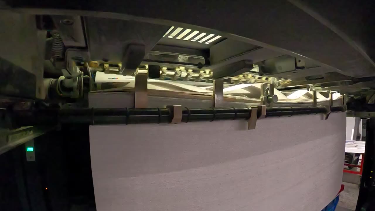 Sheets arriving at the delivery end of a Printing Partners press