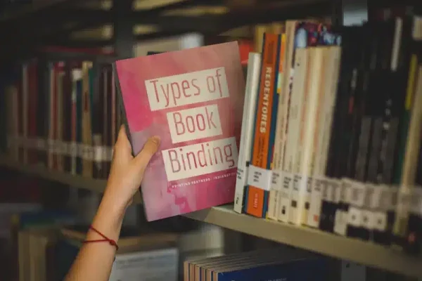 Types-of-Book-Binding-Book-being-picked-up-at-a-library-jpg Types of Book Binding Guide