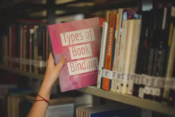 Types-of-Book-Binding-Book-being-picked-up-at-a-library-jpg Types of Book Binding Guide